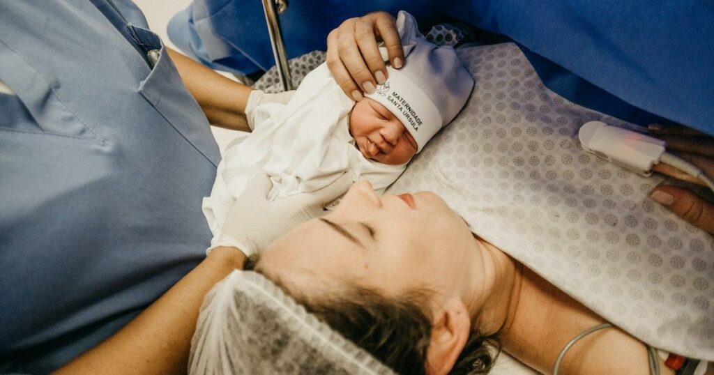 Nurse midwife and newborn baby